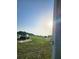 Landscape view of a grassy land, near vehicles and mobile homes in the distance at 2815 Us-41 N, Palmetto, FL 34221