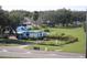 A property featuring damaged roofs and blue tarps in need of repair situated on a grassy lot at 2815 Us-41 N, Palmetto, FL 34221