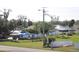 A property featuring damaged roofs and blue tarps in need of repair situated on a grassy lot at 2815 Us-41 N, Palmetto, FL 34221