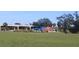 Vacant land near highway with storm-damaged structures in the distance at 2815 Us-41 N, Palmetto, FL 34221