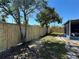 Backyard showcasing a newly installed wood fence, providing privacy and a secure space for recreation at 2820 Wood St, Sarasota, FL 34237