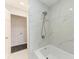 Updated bathroom with modern tile tub and shower combination with rainfall shower head at 2820 Wood St, Sarasota, FL 34237