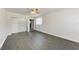Spacious bedroom features hardwood floors, a ceiling fan, and two windows for ample natural light at 2820 Wood St, Sarasota, FL 34237