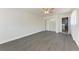 Bedroom with modern flooring, a ceiling fan, and access to a laundry room for added convenience at 2820 Wood St, Sarasota, FL 34237