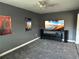 Bedroom featuring gray walls, gray carpeting, and a ceiling fan at 2820 Wood St, Sarasota, FL 34237