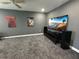 Bedroom featuring gray walls, gray carpeting, and a ceiling fan at 2820 Wood St, Sarasota, FL 34237