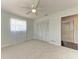 This bedroom features plush carpeting, a ceiling fan, and ample closet space at 2820 Wood St, Sarasota, FL 34237