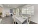 Bright dining room with a floral tablecloth, hardwood flooring, and natural light at 2820 Wood St, Sarasota, FL 34237