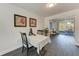 Bright dining area featuring hardwood floors, a table, and artwork at 2820 Wood St, Sarasota, FL 34237