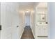 Bright hallway leading to a well-appointed bathroom, providing a clean and functional space at 2820 Wood St, Sarasota, FL 34237