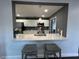 Kitchen with stainless steel appliances and breakfast bar seating at 2820 Wood St, Sarasota, FL 34237