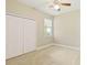 Bright bedroom with double door closet and carpet flooring at 3002 Florida Elm Pl, Seffner, FL 33584