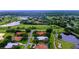 Aerial view showcasing a house nestled in a golf course community near lakes at 3105 Charles Macdonald Dr, Sarasota, FL 34240