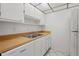 Well-maintained kitchen with white cabinetry, wood countertops, and modern appliances at 3267 Beneva Rd # 201, Sarasota, FL 34232