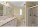 Updated bathroom with vanity, toilet and shower stall at 3386 Oakwood N Blvd, Sarasota, FL 34237