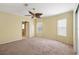 Bright bedroom with ceiling fan and ensuite bathroom access at 3386 Oakwood N Blvd, Sarasota, FL 34237
