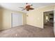 Comfortable bedroom with ceiling fan and sliding door closet at 3386 Oakwood N Blvd, Sarasota, FL 34237