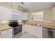 Modern kitchen with stainless steel appliances and an eat-in counter at 3386 Oakwood N Blvd, Sarasota, FL 34237