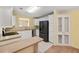 White kitchen features ample counter space and a pantry at 3386 Oakwood N Blvd, Sarasota, FL 34237