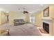 Living room featuring a fireplace and neutral carpeting at 3386 Oakwood N Blvd, Sarasota, FL 34237