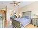 Light and airy bedroom with a queen bed and mirrored closet at 3927 Mediterranea Cir # 222, Sarasota, FL 34233