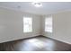 Spacious bedroom with gray walls and dark gray floors at 420 21St E St, Palmetto, FL 34221