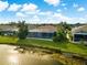 Aerial view of a home with a pool and lake access at 4252 Wordsworth Way, Venice, FL 34293