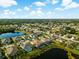 Aerial view of a beautiful community with lakefront homes at 4252 Wordsworth Way, Venice, FL 34293