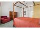 Spacious bedroom with a four-poster bed and ample closet space at 4311 65Th E Ter, Sarasota, FL 34243