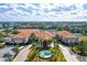 Community center with fountain and palm trees at 4311 65Th E Ter, Sarasota, FL 34243