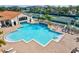 Community pool with surrounding lounge chairs at 4311 65Th E Ter, Sarasota, FL 34243