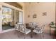 Covered patio with table and chairs, access to backyard at 4311 65Th E Ter, Sarasota, FL 34243