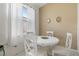 Small dining area with white table and chairs at 4311 65Th E Ter, Sarasota, FL 34243