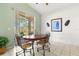 Breakfast nook with wood table and chairs, adjacent to the kitchen at 4311 65Th E Ter, Sarasota, FL 34243