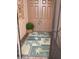 Front entry with double doors and a tropical-themed floor mat at 4311 65Th E Ter, Sarasota, FL 34243