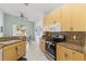Well-equipped kitchen featuring granite countertops and ample cabinetry at 4311 65Th E Ter, Sarasota, FL 34243