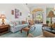 Spacious living area featuring a large window and ample seating at 4311 65Th E Ter, Sarasota, FL 34243