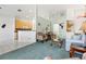 Bright living room with light-colored furniture and view to kitchen at 4311 65Th E Ter, Sarasota, FL 34243