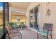 Enjoyable screened porch with multiple seating areas at 4311 65Th E Ter, Sarasota, FL 34243