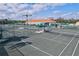 Several tennis courts with a clubhouse nearby at 4311 65Th E Ter, Sarasota, FL 34243