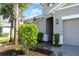 Front entrance with a walkway and American flag at 4718 Roycroft Ter, Parrish, FL 34219