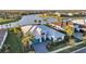 Stunning aerial view of waterfront home, lush landscaping, and community amenities at 4779 Pastel Ct, Sarasota, FL 34240