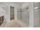 A luxurious bathroom showcases a large walk-in shower with glass and a walk-in closet at 4779 Pastel Ct, Sarasota, FL 34240