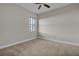 Bedroom with carpet flooring, ceiling fan, and window at 4779 Pastel Ct, Sarasota, FL 34240