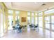 Clubhouse room with seating, large windows, and a bright, inviting atmosphere for gatherings at 4779 Pastel Ct, Sarasota, FL 34240