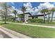 Modern community building featuring well-maintained lawns, landscaping, and ample parking at 4779 Pastel Ct, Sarasota, FL 34240