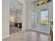 Inviting foyer featuring decorative glass double doors and tiled flooring leading to an office area at 4779 Pastel Ct, Sarasota, FL 34240