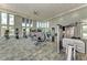 Bright gym with a full range of fitness equipment, large windows, and ample workout space at 4779 Pastel Ct, Sarasota, FL 34240