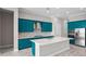 Well-appointed kitchen featuring an island, stainless appliances, and stylish cabinet design at 4779 Pastel Ct, Sarasota, FL 34240
