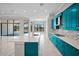 Gourmet kitchen boasting an island, custom cabinets, quartz counters, and an open design at 4779 Pastel Ct, Sarasota, FL 34240